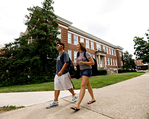 Photo of two students walking on the EKU campus